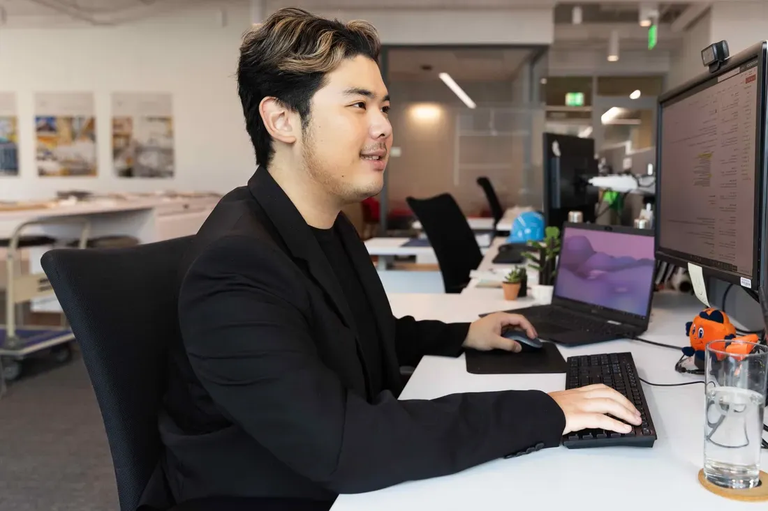 Student sitting on computer working.